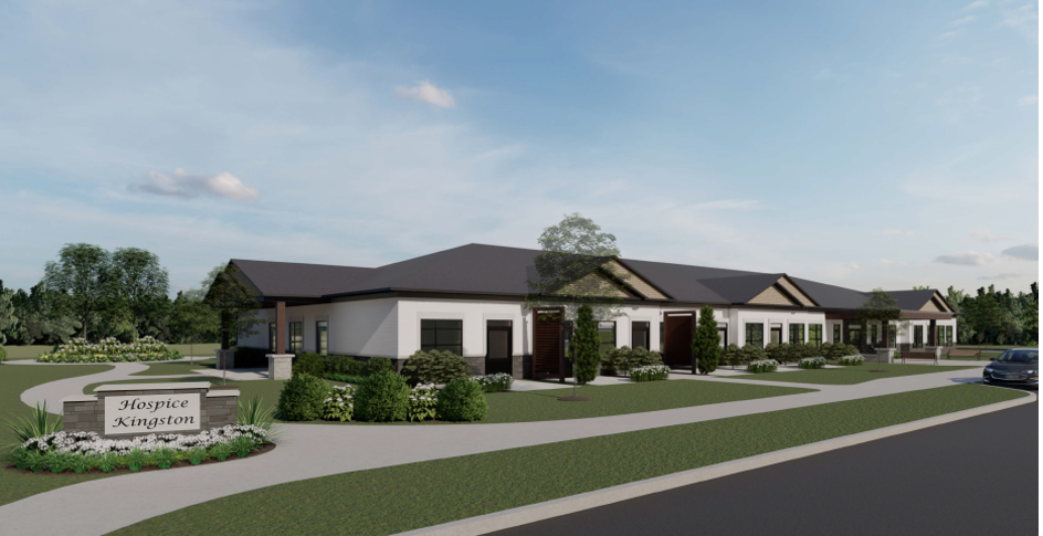 Architectural rendering of Hospice Kingston facility featuring a single-story white sided building with multiple entrances and a landscaped front yard with a sign displaying 'Hospice Kingston.'