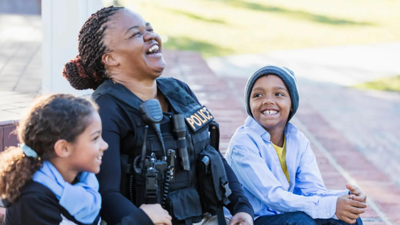 Garnet Police officer with her children