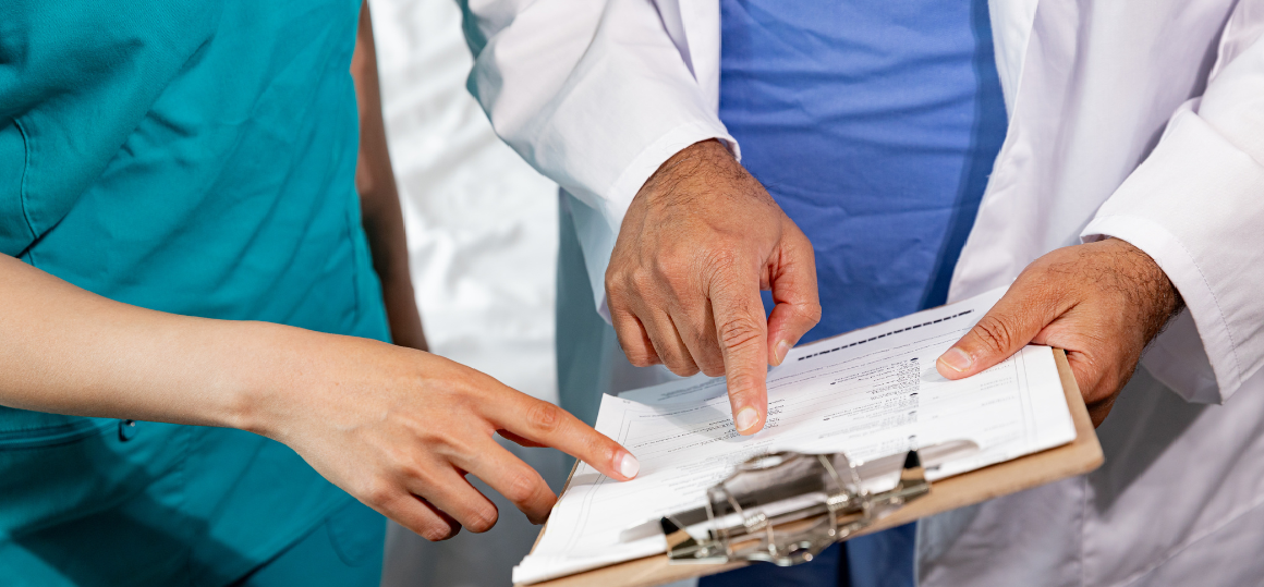 Healthcare professionals talking about a chart