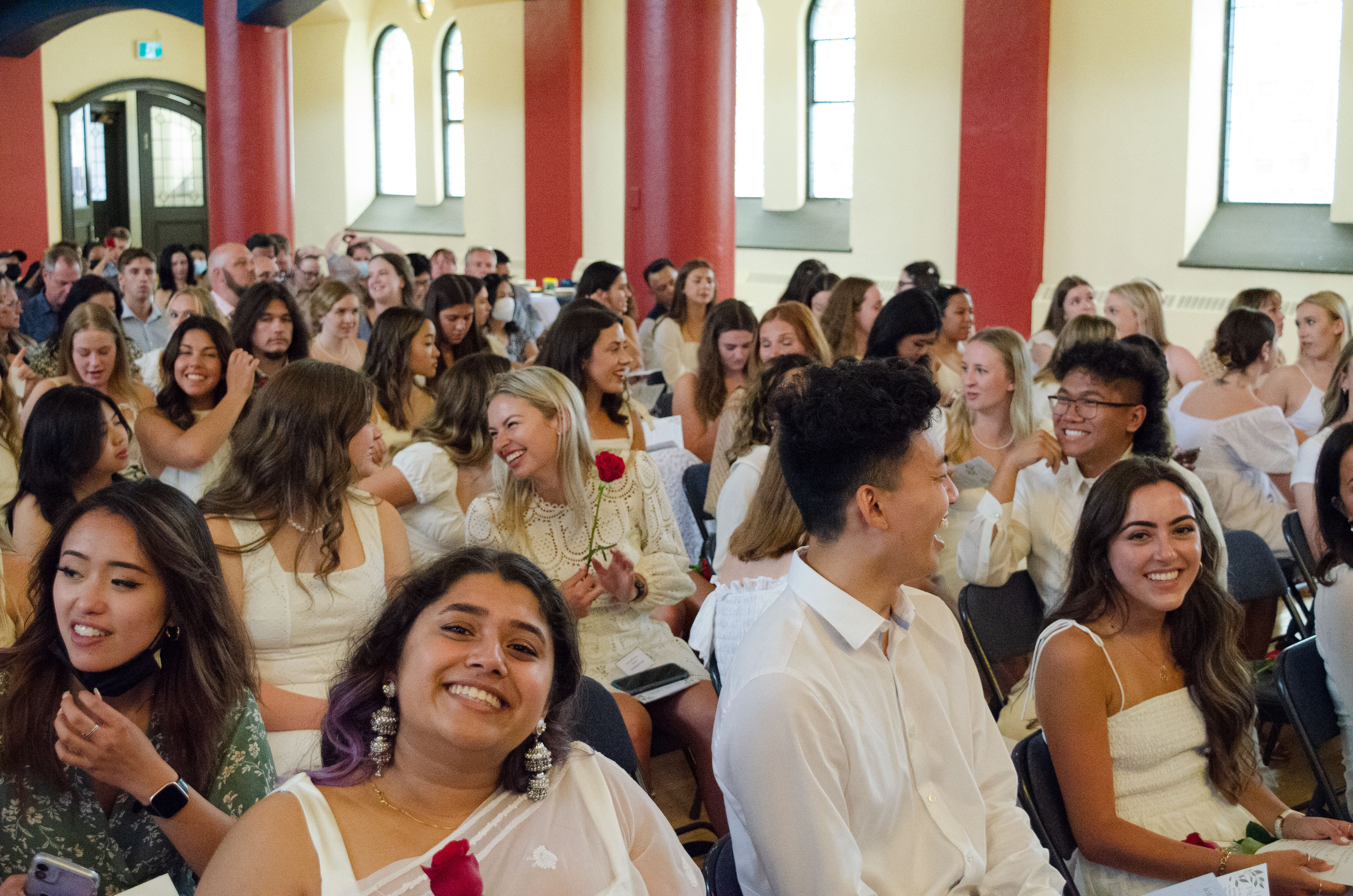 group photo of class of 2022 nursing students smiling at their pinning ceremony
