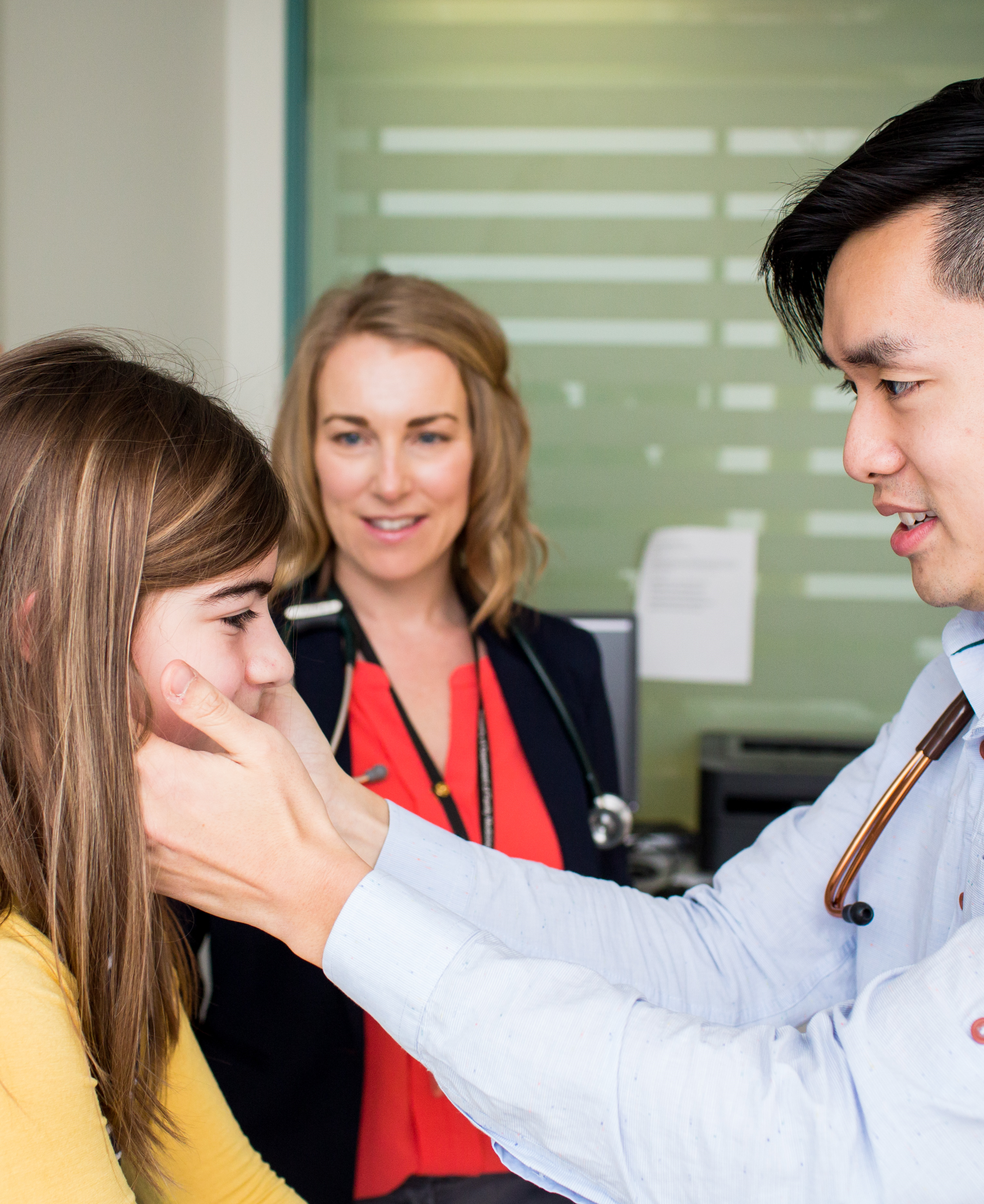 Photo of two healthcare providers and a patient