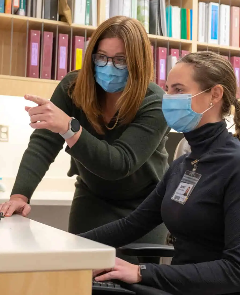 Drs. Goldie and Moore-Vasram look at a monitor