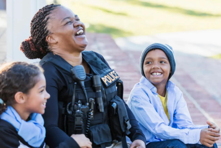Garnet Police officer with her children