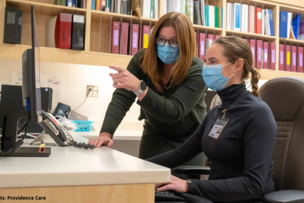 Dr. Goldie and Dr. Moore-Vasram looking at a monitor